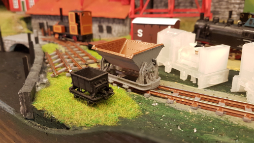 162654  -- here it clearly shows the difference in scale.. MiniTrains cement wagon left with 3D print skip to the right