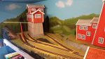 After the grass dried from yesterday I turned around the layout back again and placed out buildings and track once more.
Now I reached a state there I feel it is time to lay down some tracks for good. Detailing of the scenery can go on for ever, but ...