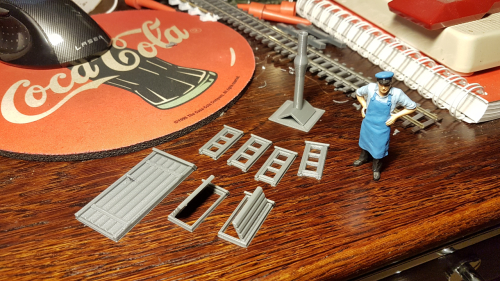 172626  -- door, windows, hatches and chimney laid out on the table