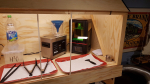 Installed electrics and the front plexiglass sliding doors. Replaced the fan tube with a much more loose tube, normally used for drying cabinets. Prepared the window so that a nozzle will attach easily. Started on a new nozzle, the first was not go..