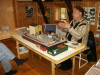 Pict8761 -- Roger himself with his mini-layout for 1/35, explaining for one of the visitors his theory on ´glad-bygge´ (happy modelling with no rivet-counting). Roger did fill 3 of these tables with his stuff.