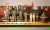 Pict2666 -- figure parade. Spiritos 7/8in EJ figure, Dragon 1/16 #1608, Tamiya 1/16 #36302, Verlinden 1/16 #979, Two F-scale (1/20.3) unpainted figures from SLM, 1/24 figure Walt from SLM and sitting by the table, Royal Model 1/16 #215.
