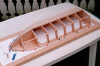 dayc-0602 -- 1 - Hull halfway ready. Frame 1 and 2 is different, but 3 to 7 is the same as the stern-frame except it has the middle part cut out. Plus this the stem-keel part. Which does not need to be solid, I did it like this so I got four different ´rooms´ in case it get flued with water. I will use a rather big battery and along with big engines, it will not flute water-filled without air-bags..